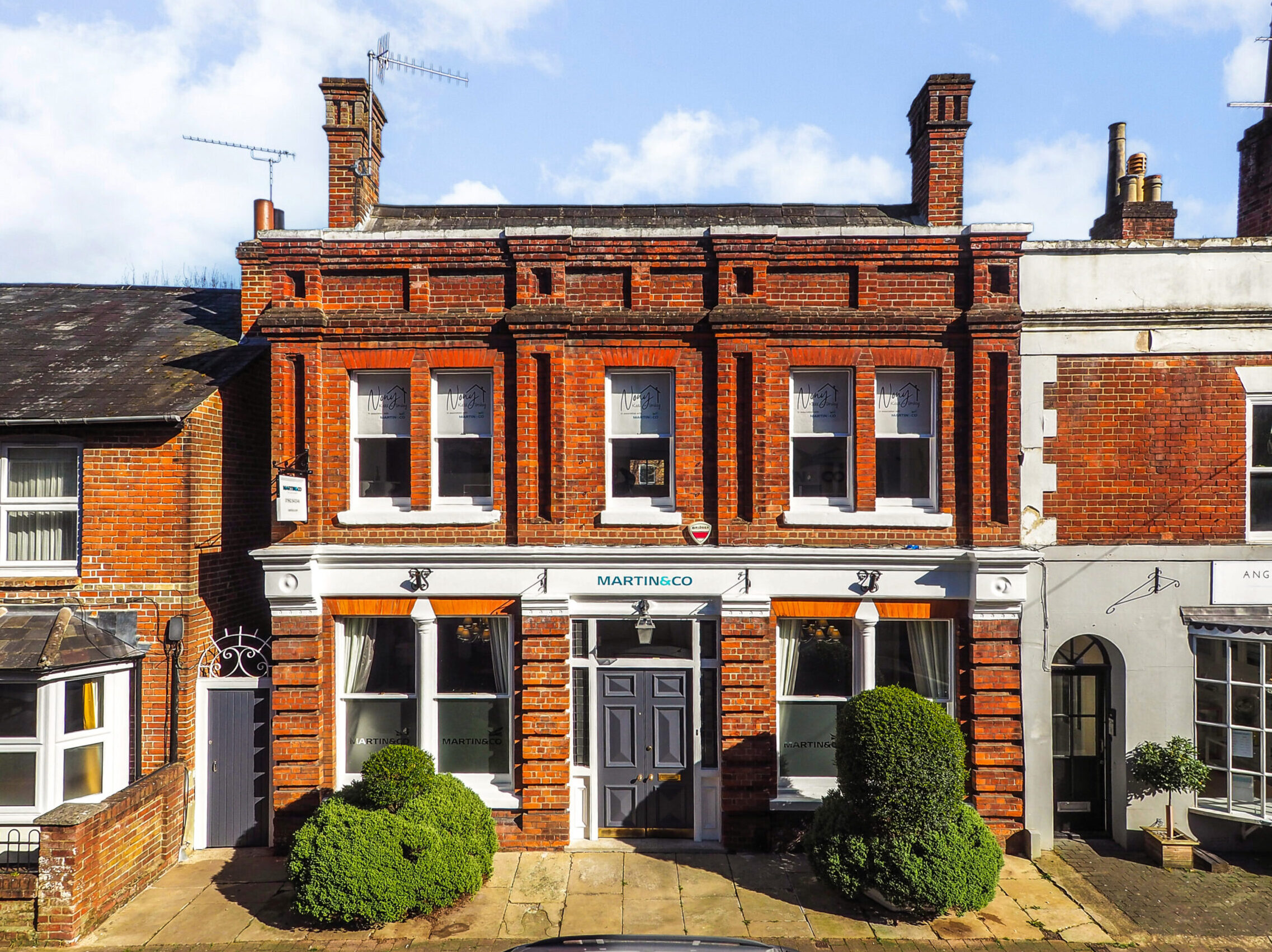 An exterior view of the Martin &amp; Co estate agent office in Winchester.