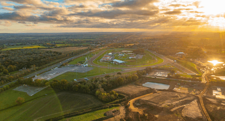 Aerial view of Chelmsford countryside and housing developments at sunset, representing the city’s thriving summer 2025 property market