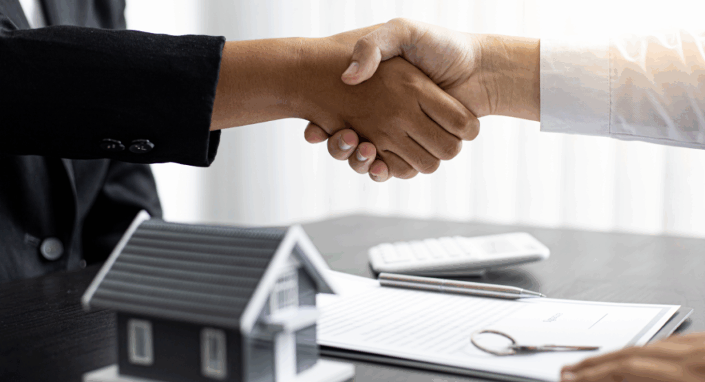 Landlord and tenant shaking hands over rental contract in Solihull property market