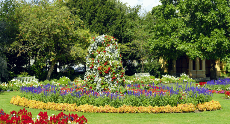 =Colourful flower garden in Leamington Spa with Regency-style surroundings, symbolising the town’s charm and strong property market in 2025