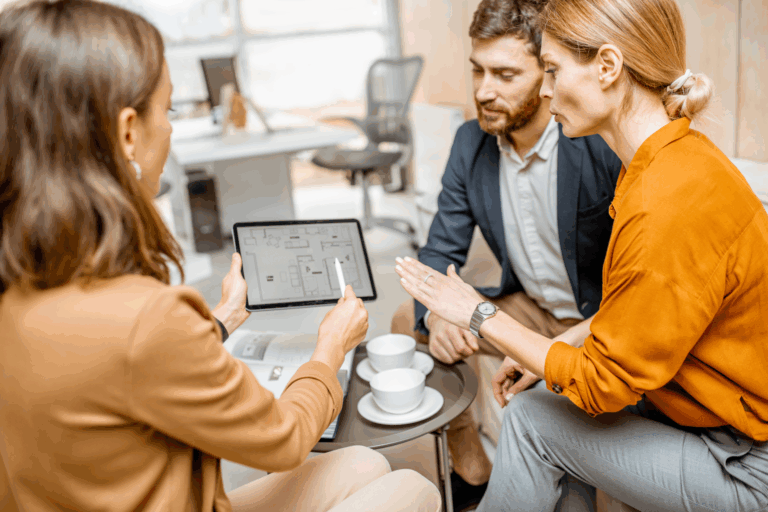 Letting agent discussing winter maintenance plans with landlords in a Westbury rental property