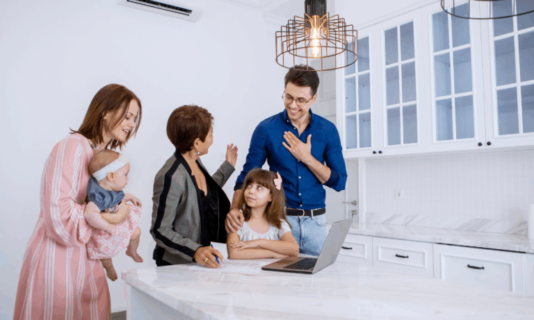 Family reviewing property documents with an estate agent while planning a home purchase in Bath ahead of the 2026 property market.