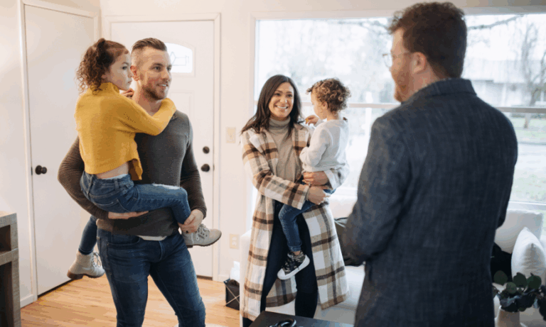 Family viewing a Stirling home with an estate agent during winter, showing how warm presentation helps attract serious buyers