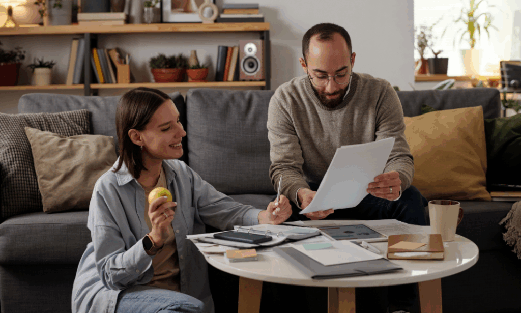 Landlords reviewing smart home technology and compliance documents to future-proof an Oxford rental property for winter maintenance