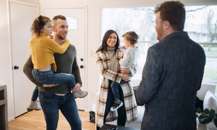 Family viewing a Stirling home with an estate agent during winter, showing how warm presentation helps attract serious buyers