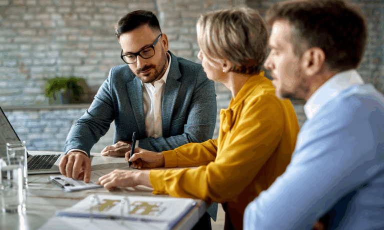 Homeowners standing in a property reflecting on rising home values in regenerated Paisley