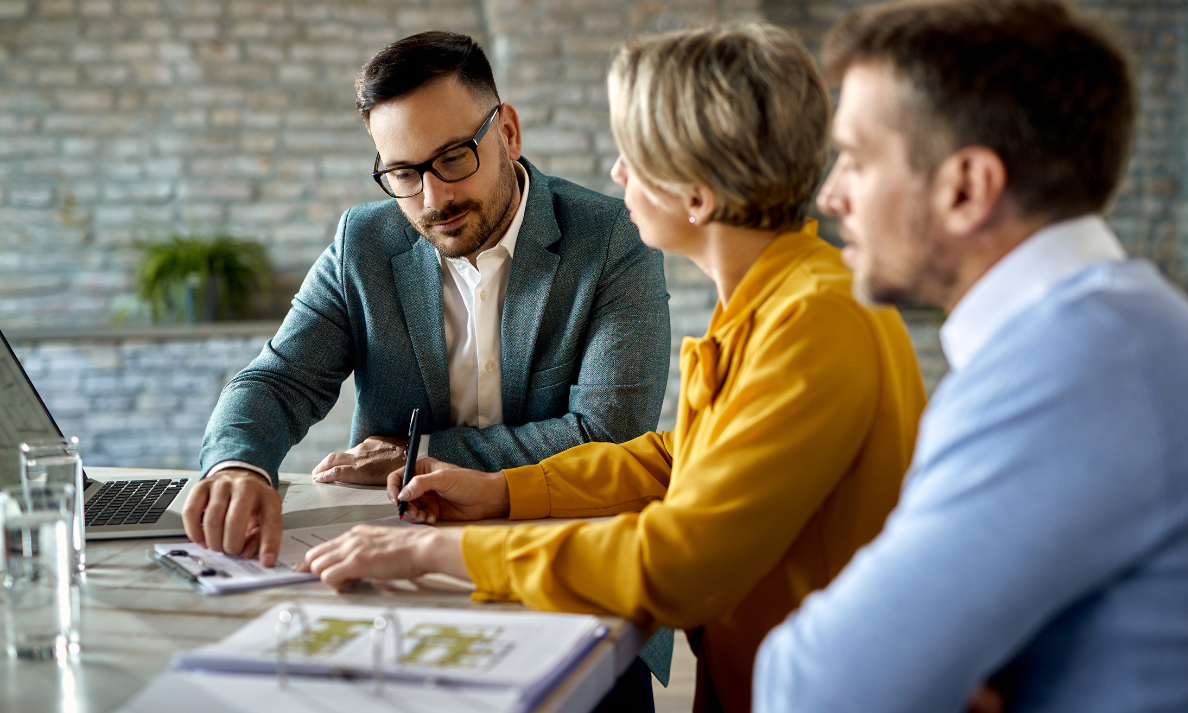 Homeowners standing in a property reflecting on rising home values in regenerated Paisley