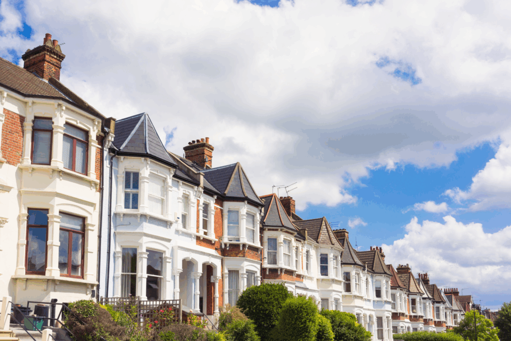 Row of traditional family houses in Chelmsford under a bright blue sky, reflecting strong demand in CM1 and surrounding areas.