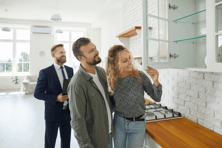 Letting agent showing a couple around a kitchen during a Westbury rental viewing, highlighting the need for compliance checks ahead of the May 2026 possession reforms.