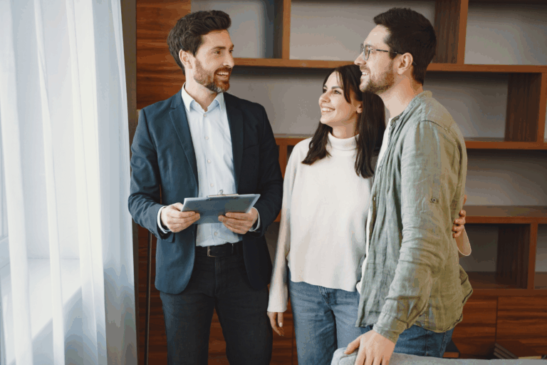 Letting agent speaking with a couple during a property viewing, reflecting how Paisley landlords can stay compliant with Local Place Plans and Scotland’s new rental standards in 2026.