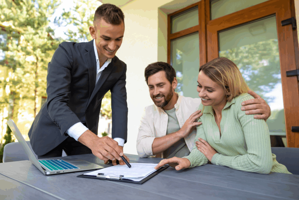 Letting agent advising a couple on rental paperwork, reflecting how landlords can prepare for the January student rush and EPC upgrades in Leamington Spa.