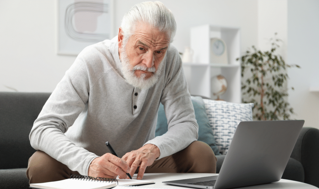 Landlord reviewing tenancy dates and rental figures on a laptop to plan a compliant Section 13 rent increase