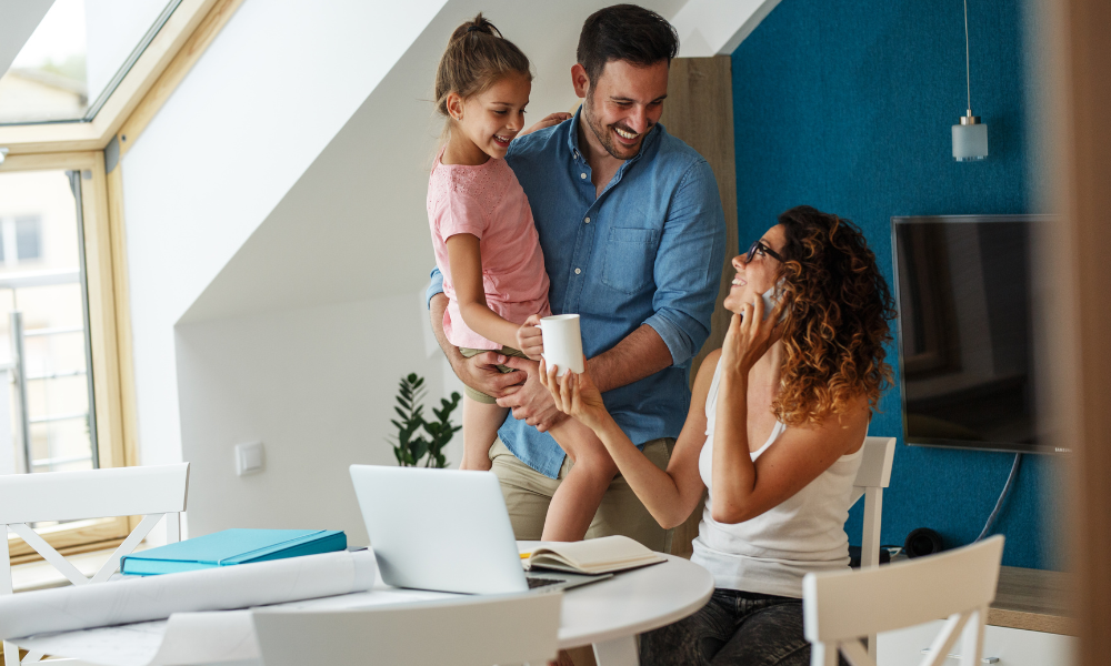 Family reviewing property plans at home in Leamington Spa, reflecting growing demand for family houses from Silicon Spa tech professionals in 2026