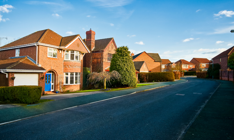 Row of suburban houses in Widnes representing rental property investment and property management compliance
