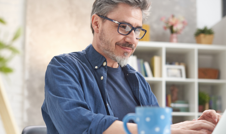 Landlord reviewing tenant referencing and affordability checks on laptop