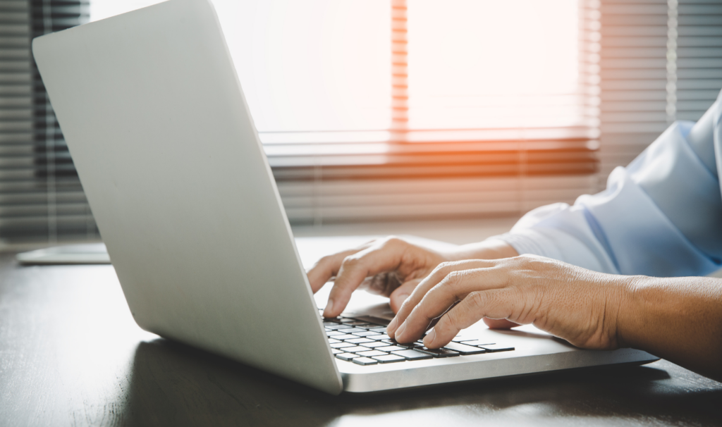 Landlord reviewing tenant affordability and referencing on laptop