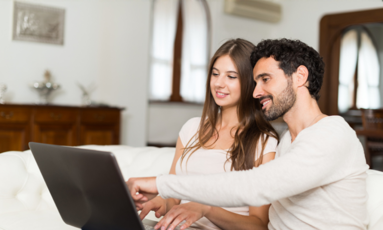 Couple viewing property online reflecting first-time buyer demand in Stoke-on-Trent housing market