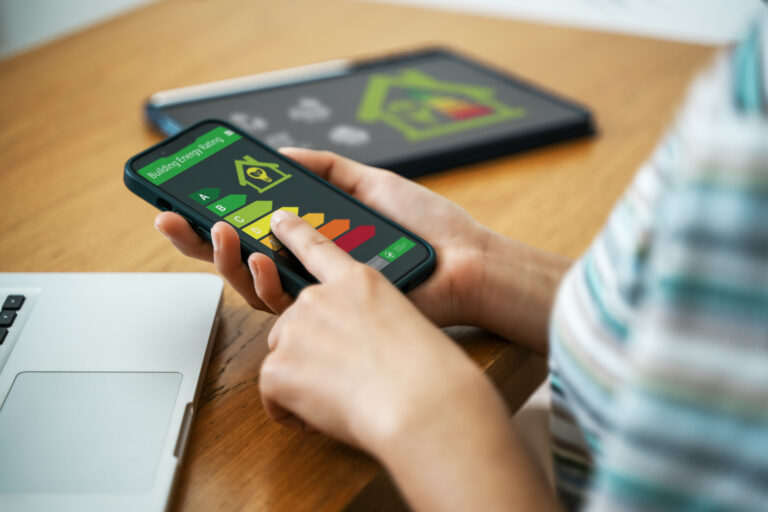 Person reviewing EPC energy rating on phone highlighting energy efficiency in Worcester rental property