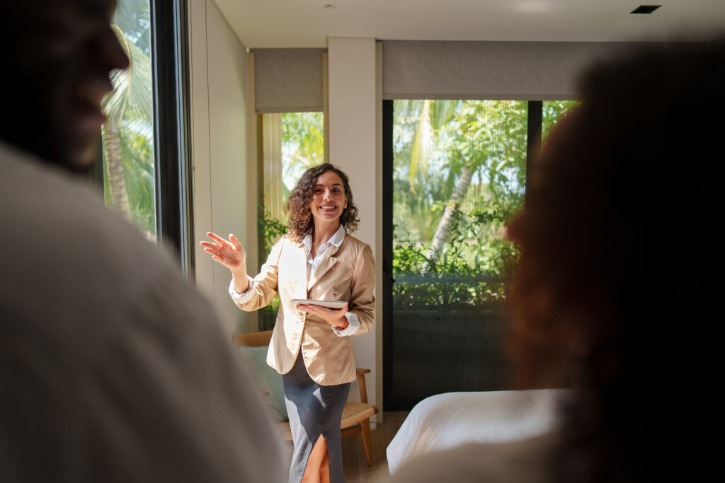 Letting agent speaking with property owners during a viewing, representing landlord legal help and property management in Reading
