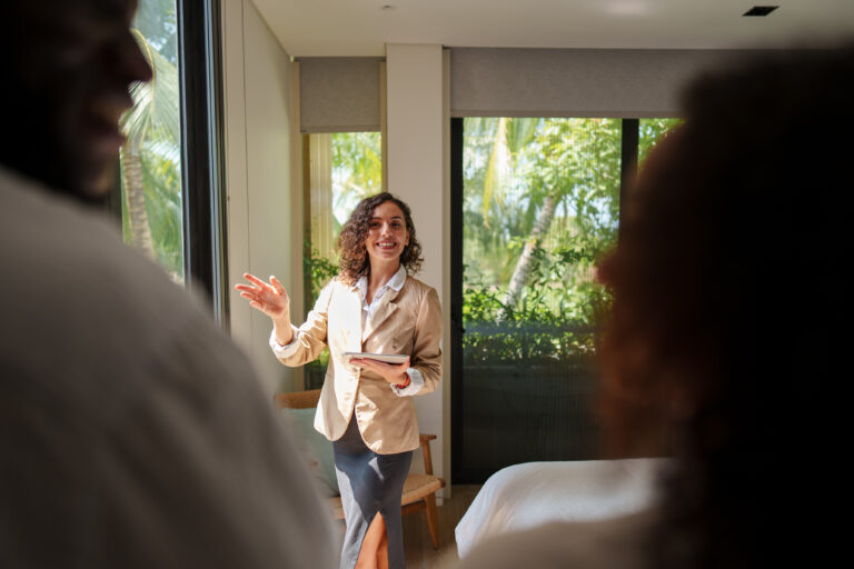 Letting agent speaking with property owners during a viewing, representing landlord legal help and property management in Reading