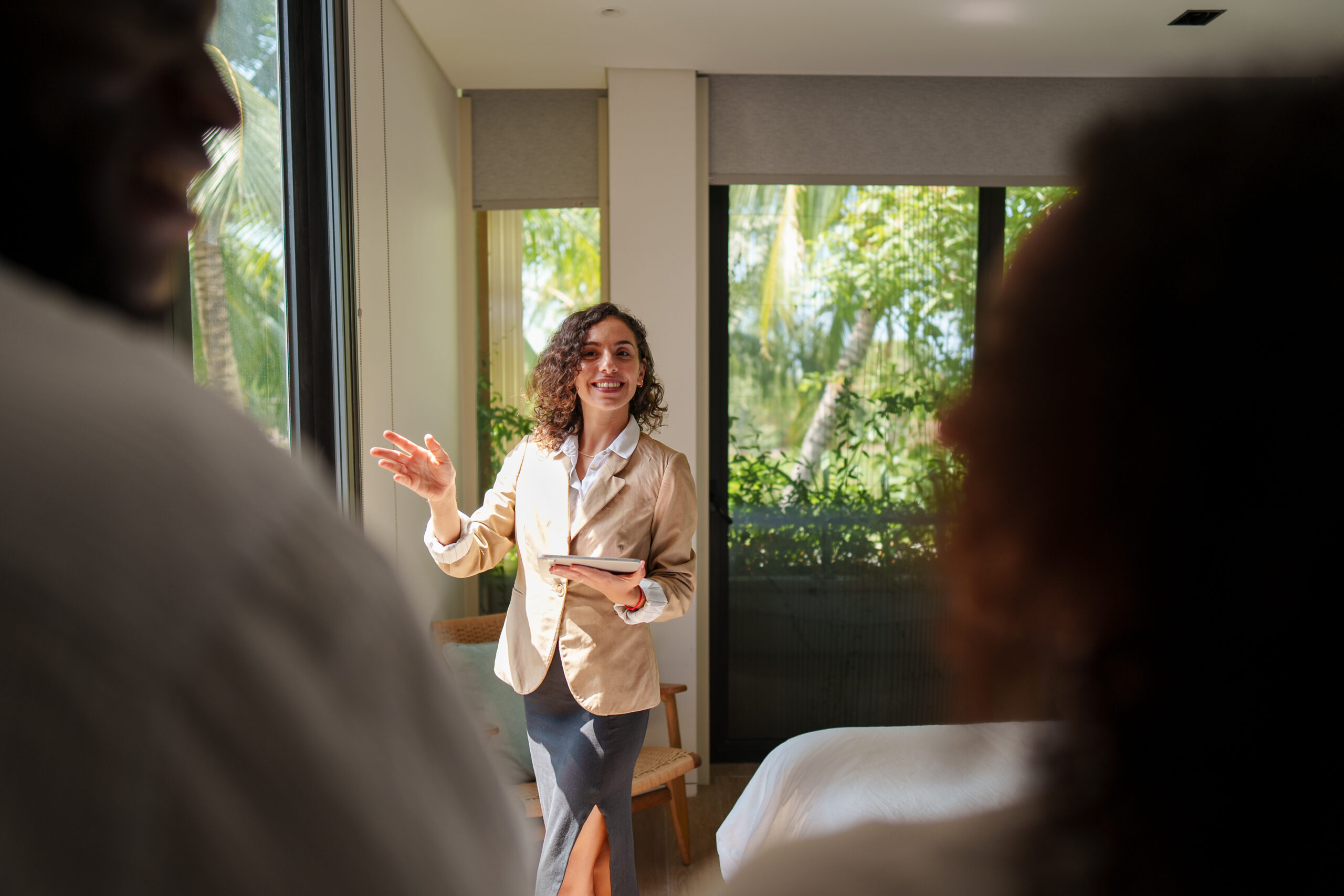 Letting agent speaking with property owners during a viewing, representing landlord legal help and property management in Reading