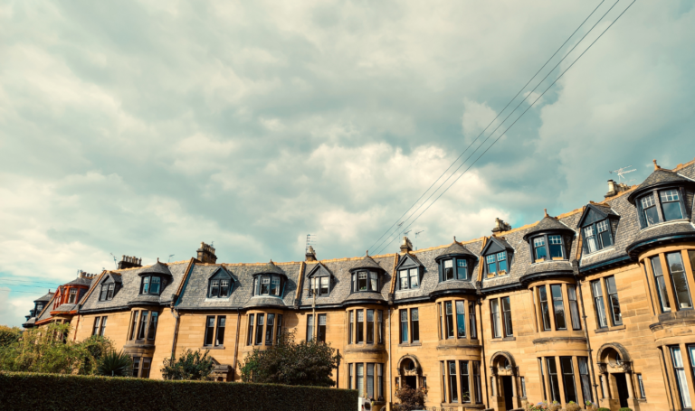 Row of traditional sandstone townhouses in a Scottish city neighbourhood