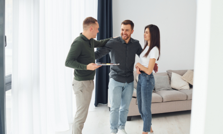 estate agent showing property to couple inside modern home Bridge of Allan FK9