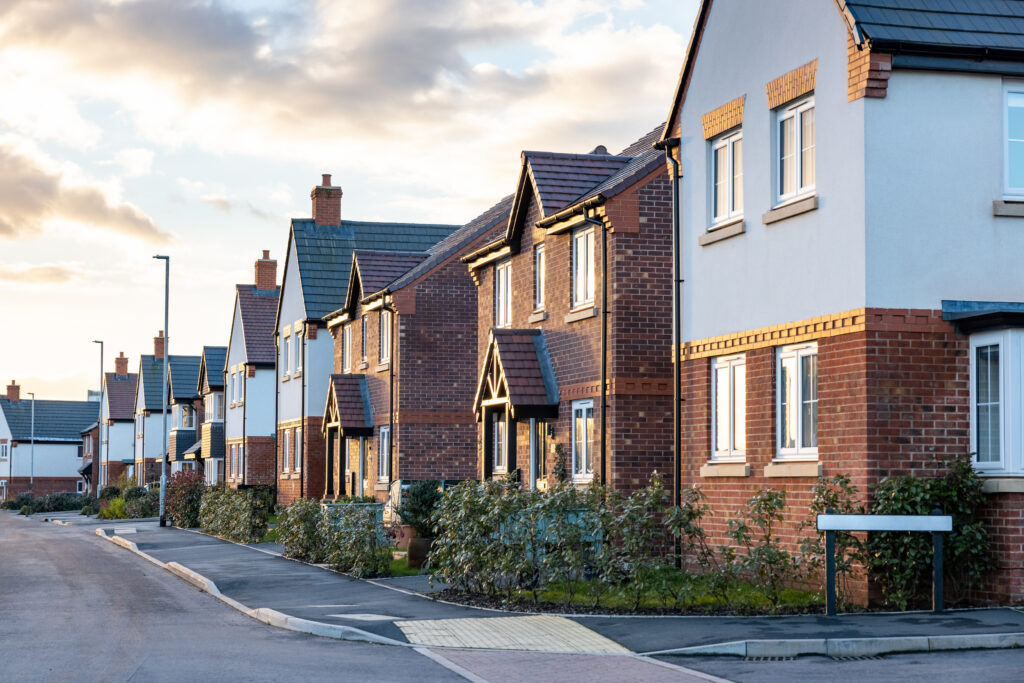 Row of modern new build houses in a suburban Aberdeen neighbourhood during sunset