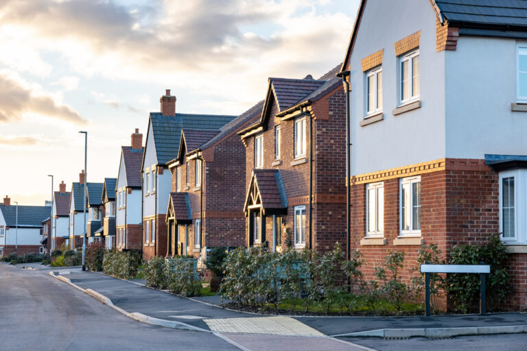 Row of modern new build houses in a suburban Aberdeen neighbourhood during sunset