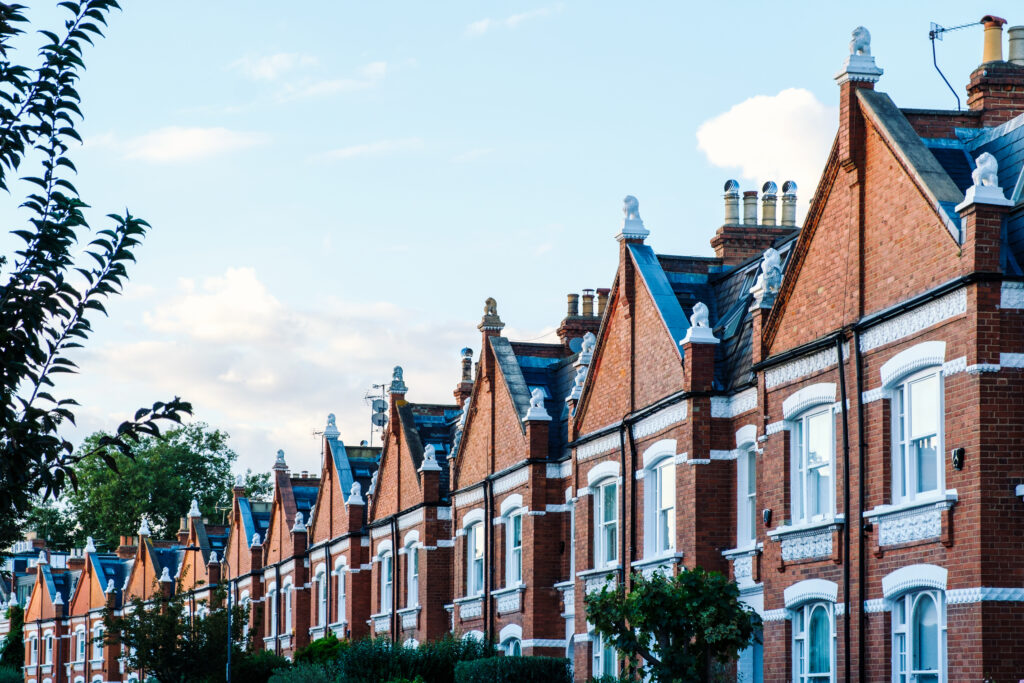 Row of traditional red-brick houses in a quiet village street in Chelmsford