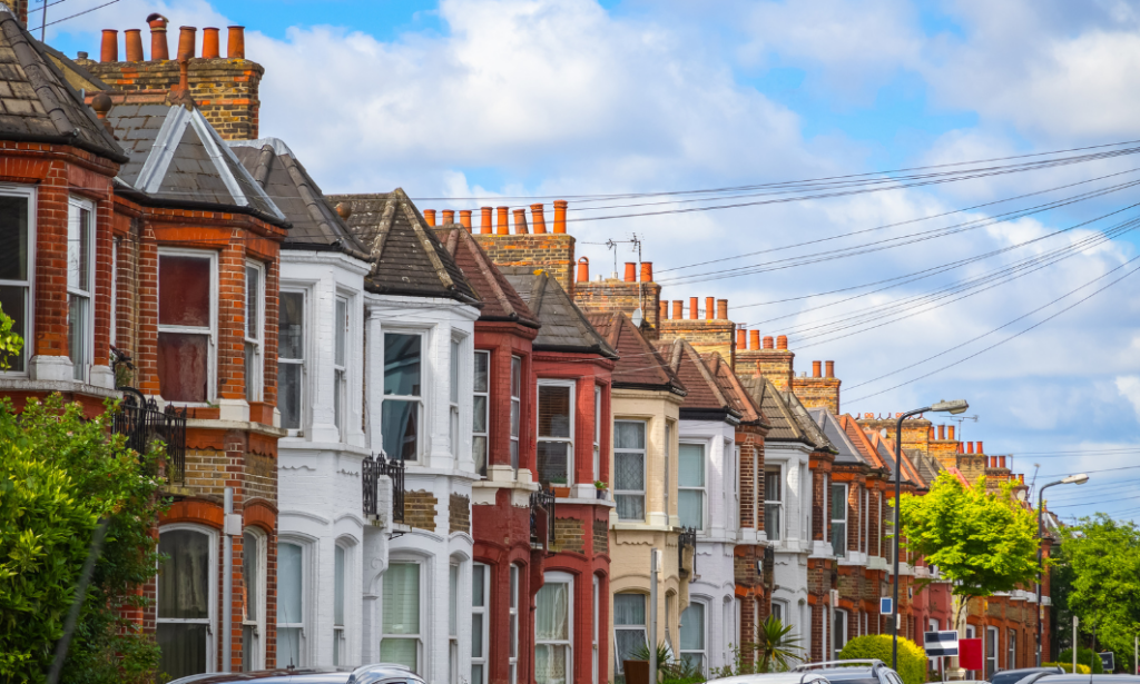 row of traditional terraced houses in Newcastle-under-Lyme ST5 residential street