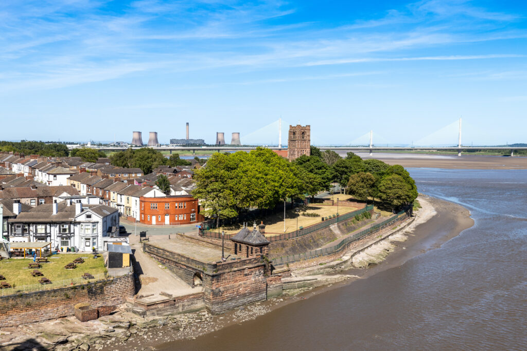 Aerial view of Hough Green Widnes showing riverside housing and transport links
