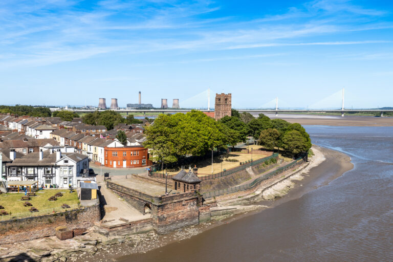 Aerial view of Hough Green Widnes showing riverside housing and transport links