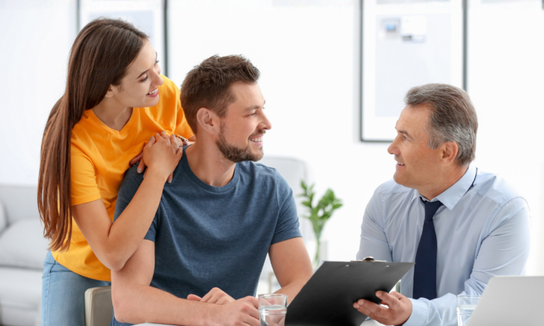 Estate agent discussing property options with couple in Norton Worcester