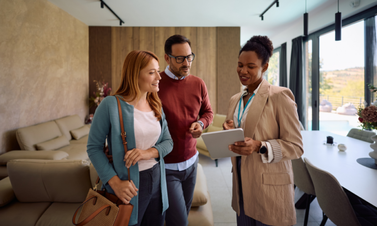 Landlord and tenants discussing a rental agreement inside a modern property in Worcester.