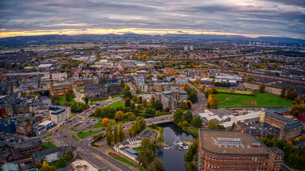 Aerial view of Paisley town centre with residential areas and key rental investment locations in Scotland.