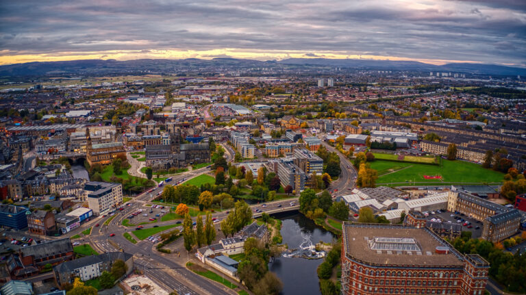 Aerial view of Paisley town centre with residential areas and key rental investment locations in Scotland.