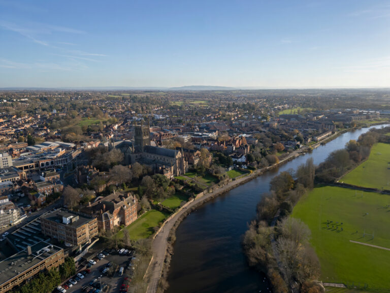 Drone view of Worcester Cathedral and the River Severn flowing through Worcester city centre