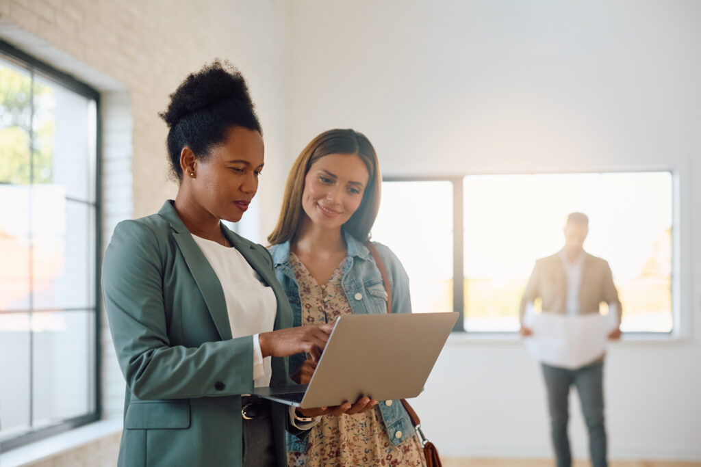 Letting agent showing a prospective tenant around a bright rental property, representing Bath rental yields and landlord investment opportunities.