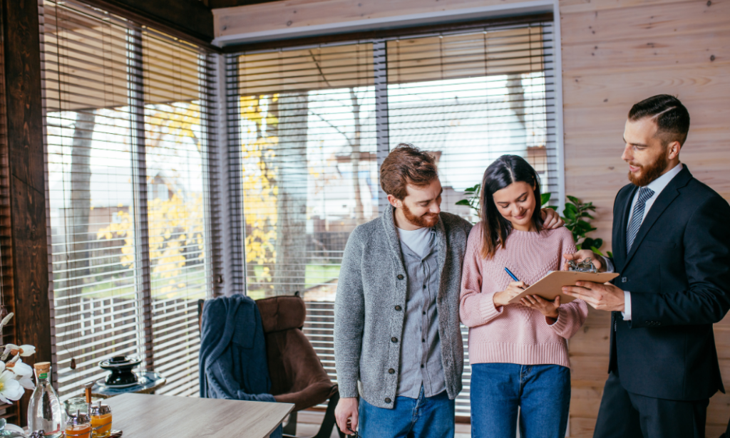 Letting agent discussing tenancy paperwork with prospective tenants in Southampton, highlighting tenant selection, referencing and long-term rental management.