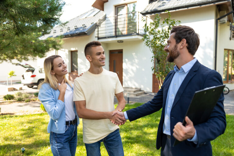 Letting agent meeting tenants outside a rental property, representing Making Tax Digital support for Paisley landlords and buy-to-let property management.