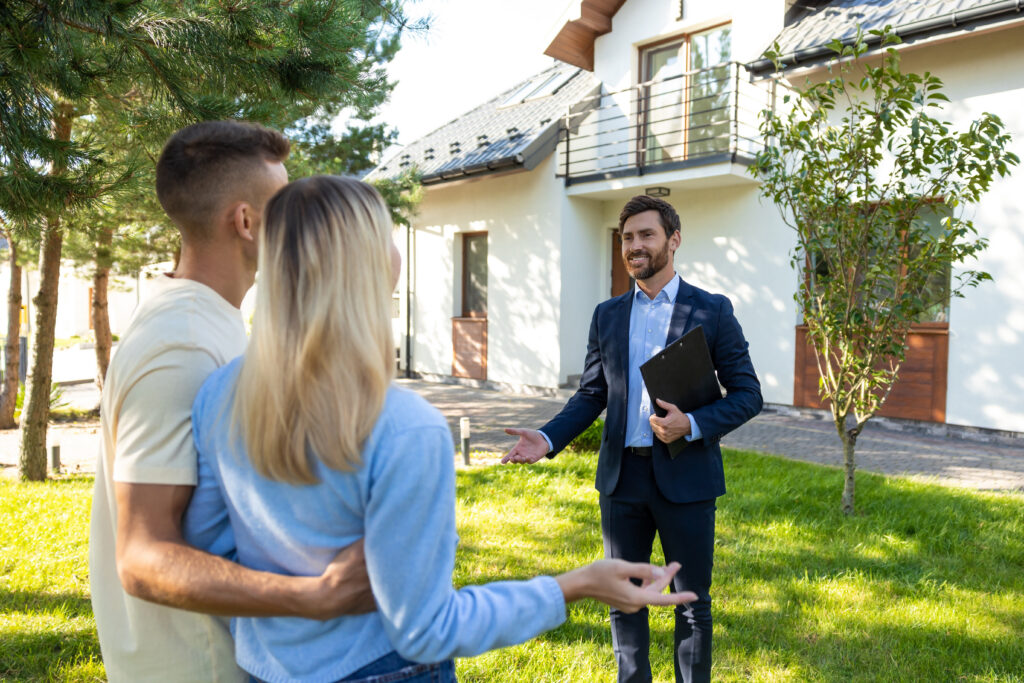 Letting agent advising tenants outside a rental property, representing Oxford HMO licensing, landlord compliance and property management.