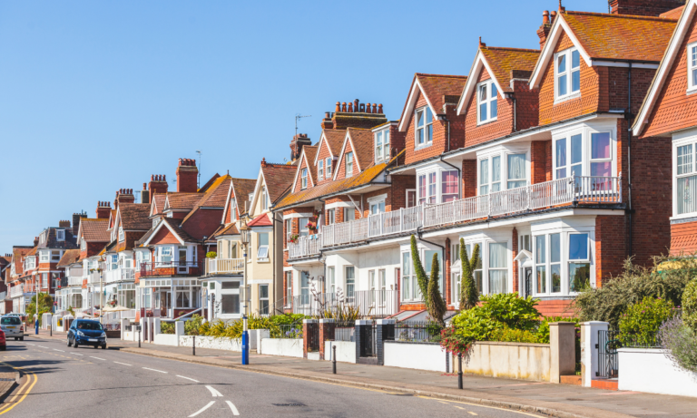 Row of attractive residential homes in Welwyn Garden City, representing local property values and station-distance demand.