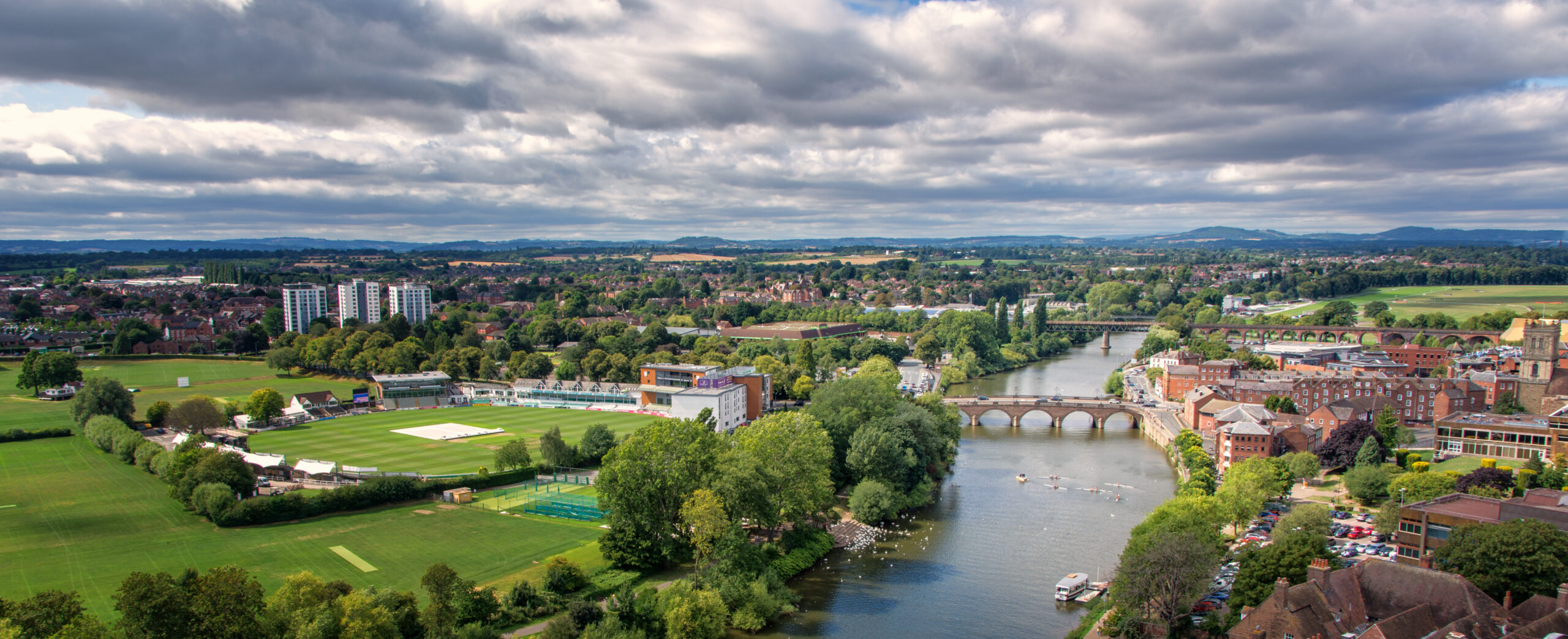 A panoramic view of Worcester with the River Severn, green spaces, historic buildings and city surroundings, representing the lifestyle and location appeal of living in WR1.