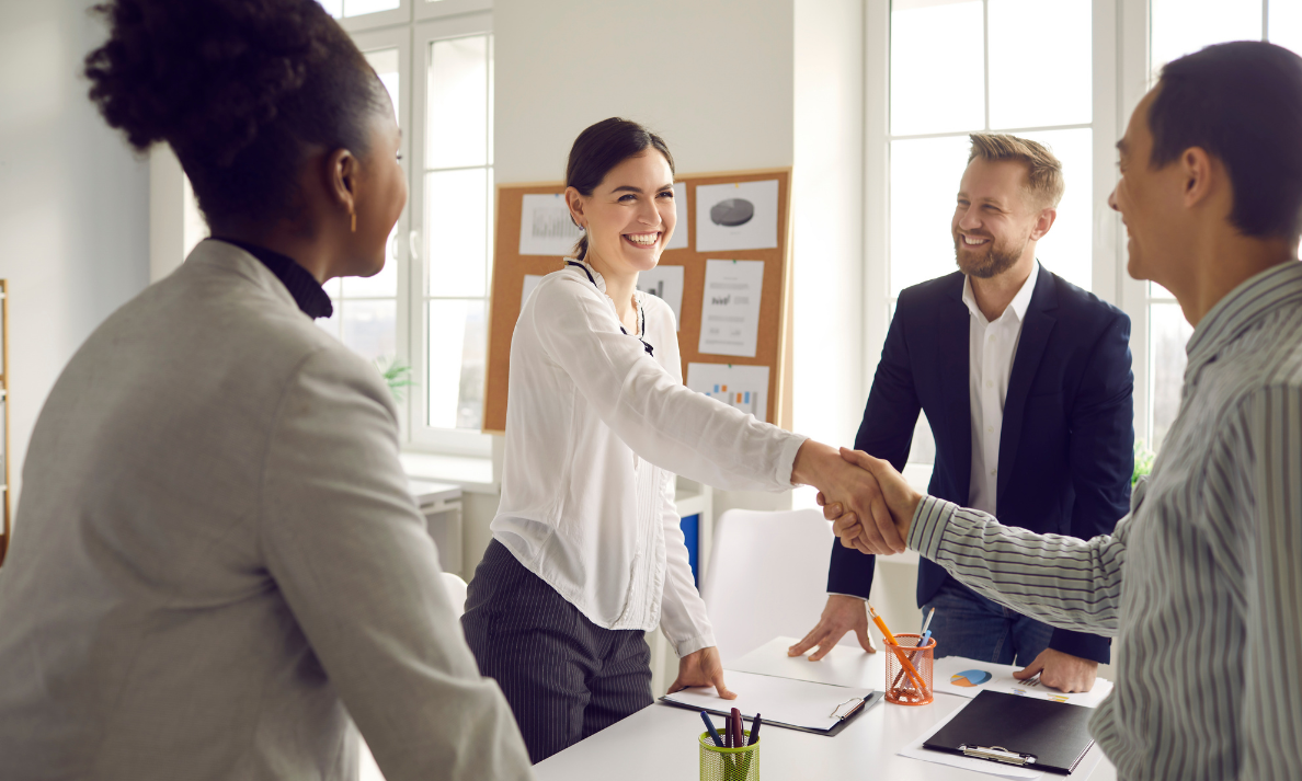Letting agent shaking hands during a property meeting, reflecting landlord advice, rental market guidance and professional lettings support in Cardiff.