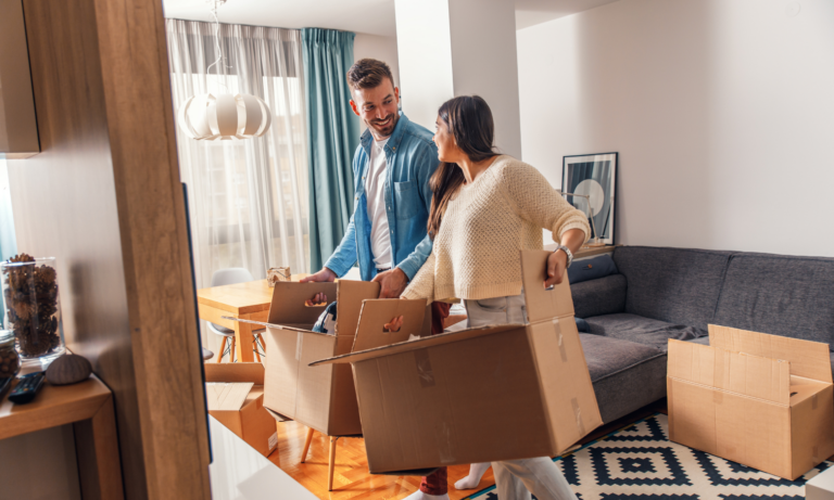 A couple unpacking moving boxes in their new rental home in Uckfield, East Sussex.