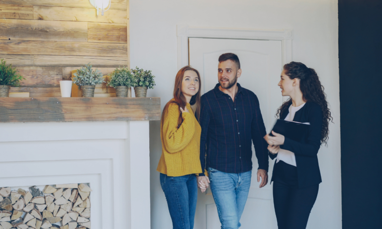 Letting agent speaking with a couple during a property viewing, representing Private Residential Tenancy guidance for landlords in Stirling.