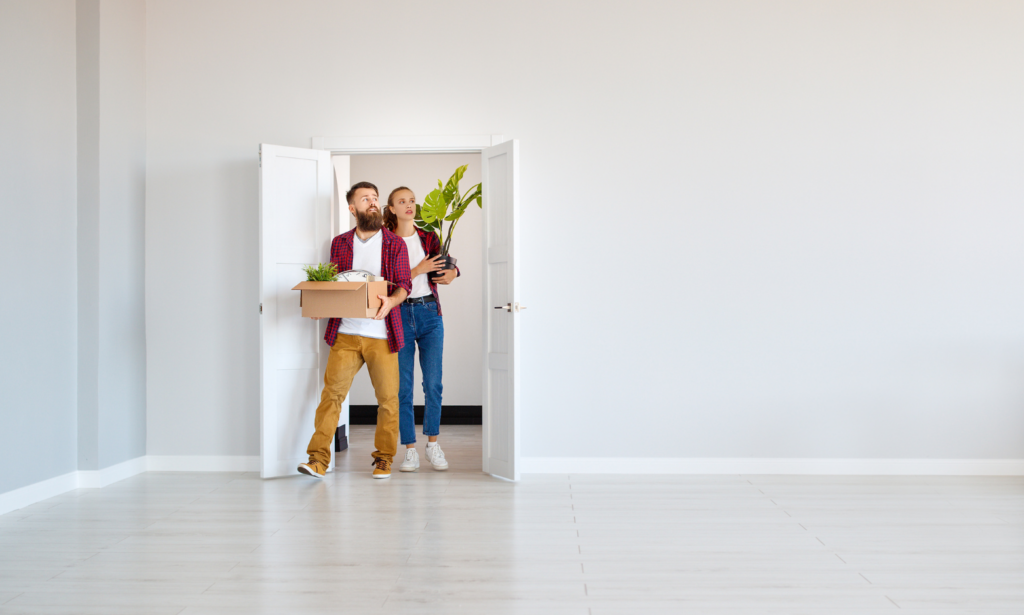 A couple entering a bright rental property during a viewing in Welwyn Garden City.