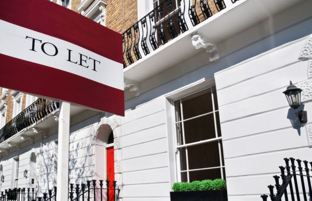 A To Let sign prominently displayed outside a building, indicating available rental space.