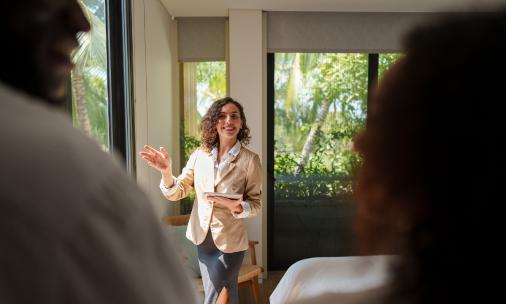An estate agent welcoming prospective buyers during a property viewing in south Birmingham.